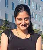 female with dark hair wearing black